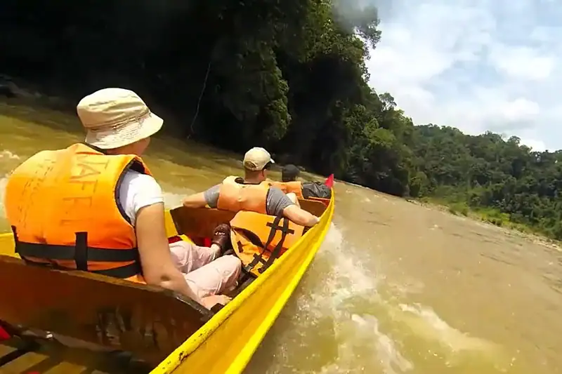 Tourists enjoying a rapid shooting boat ride on the Tembeling River in Taman Negara Pahang