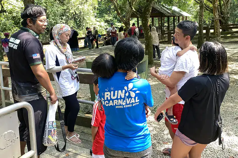 Tourists buying bathing with elephant tickets at Kuala Gandah Elephant Sanctuary
