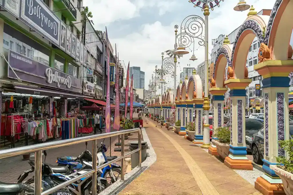 Little India Brickfields in Kuala Lumpur, featuring colourful arches, street shops and a lively cultural atmosphere often enjoyed by visitors exploring the city.