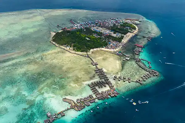 Aerial view of Mabul Island showing shallow reefs and overwater chalets