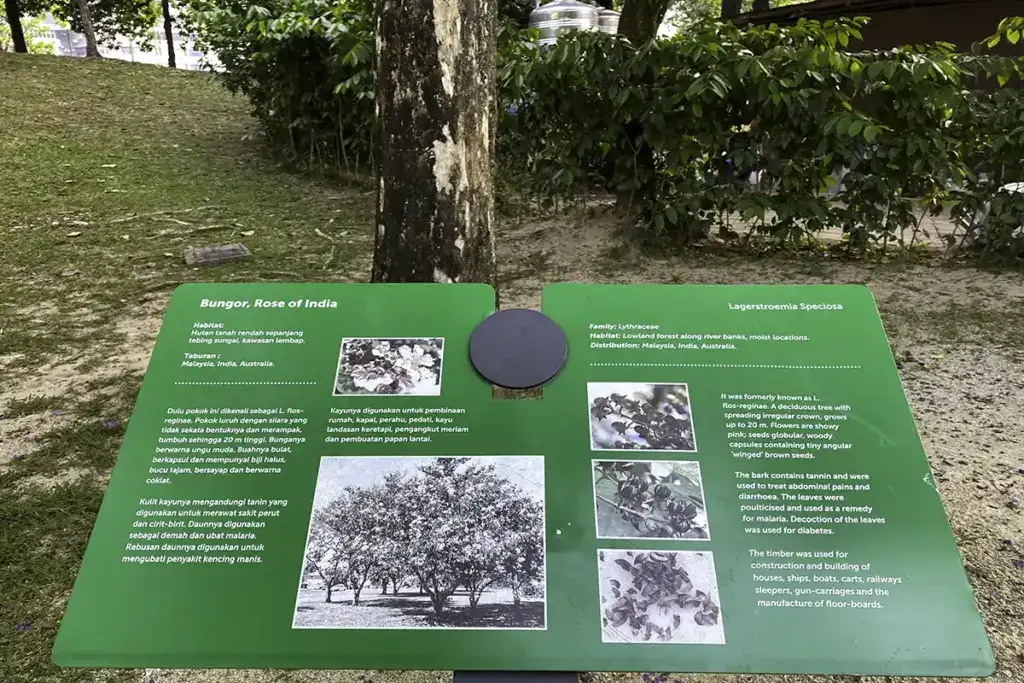 Information board along shaded garden trails at KLCC Park