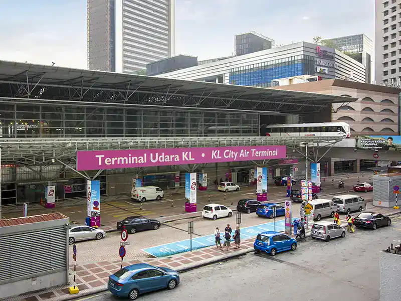 KL Sentral transport hub in Kuala Lumpur with trains, public transport connections and travellers moving around the station