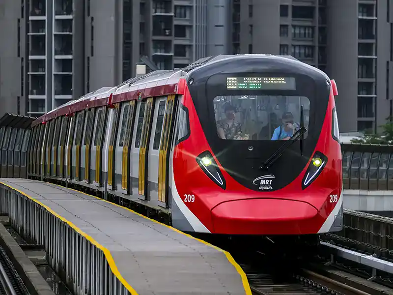 MRT train in Kuala Lumpur traveling on elevated tracks, part of the city’s public transport system connecting major district in Kuala Lumpur