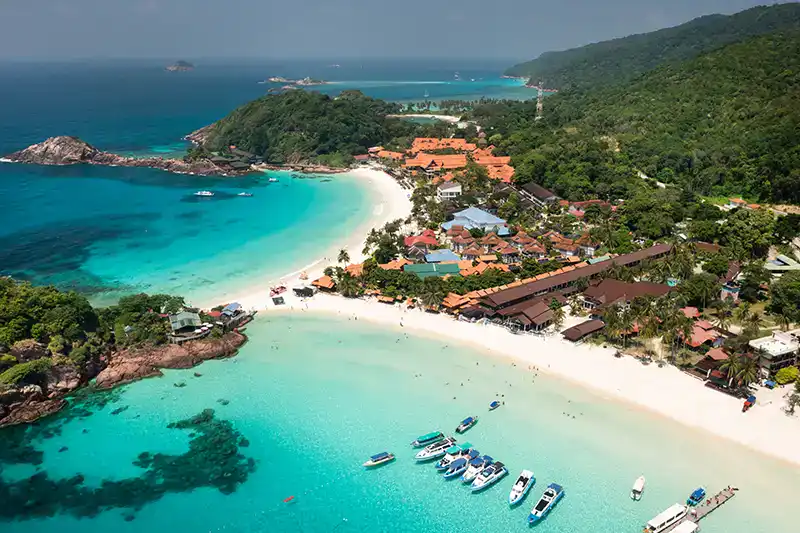 Aerial view of a calm beach and clear water on an East Coast island in Malaysia